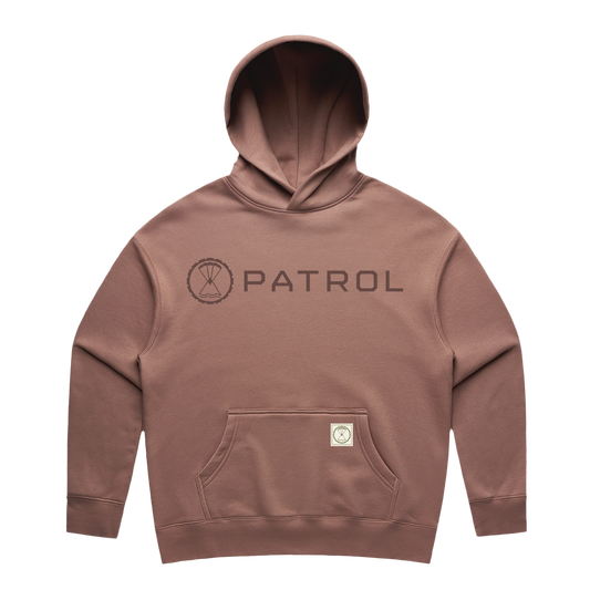 Patrol Goods Women's relaxed fit hoodie in pink with dark taupe logo. Ladies outdoor clothing.